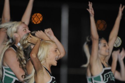 Palo Verde cheerleader Mallory Calhoun, center, celebrates after Panther kicker Alex Bonczyk kicks the game-tying extra point in the final minutes of the fourth quarter during Friday's game against the Spartans at Cimarron-Memorial High School.