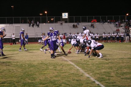 Silverado's Daren Dehart (58) gives some final directions before lining up against Coronado Friday night.
