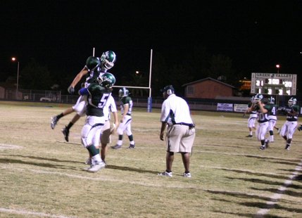 Dallas Halasz (5) gets a lift from a teammate after blocking the game-tying extra point attempt. The blocked kick lifted the Gators to a 21-20 victory.