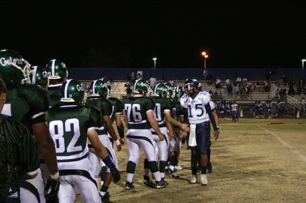 The teams line up after Friday's game. Green Valley defeated Canyon Springs, 21-20.