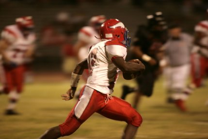 Vikings senior quarterback Kerwyn Williams races down the sideline.  Williams scored both touchdowns for Valley Friday night.