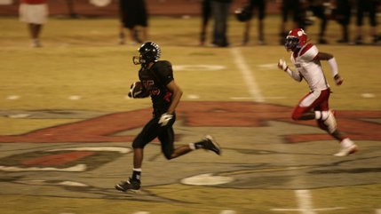 Wildcat sophomore receiver Marquan Major catches the ball and runs for a touchdown Friday night.