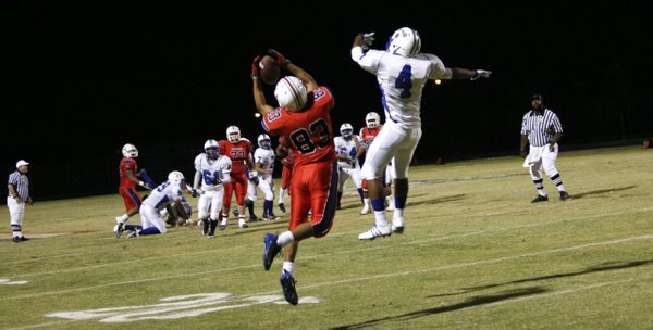 Liberty's Michael Reveles (83) intercepts a ball intended for Basic's ...