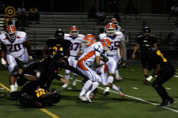 Bishop Gorman quarterback John Therrell (7) runs with the ball ...