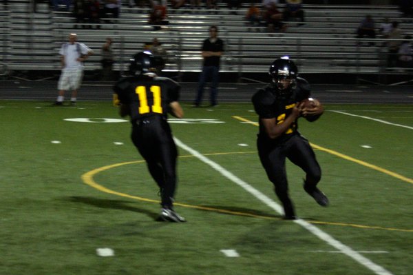 Clark senior Quincy Hatcher (12) runs the ball after receiving ...