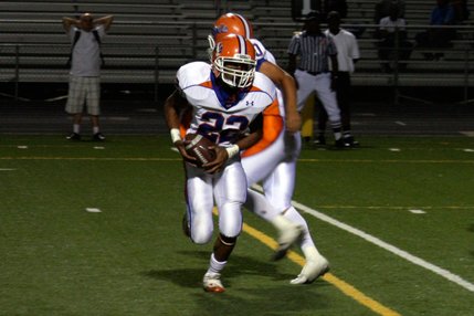 Junior Victor Belen (22) runs the ball for Bishop Gorman during Friday's game against Clark.