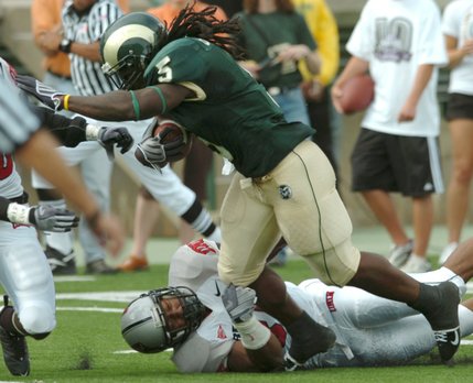 Colorado State ball carrier Gartrell Johnson III rushes past UNLV defender Daryl Forte during an NCAA college football game in Fort Collins, Colo. Saturday Oct. 4, 2008. Colorado State won 41-28.