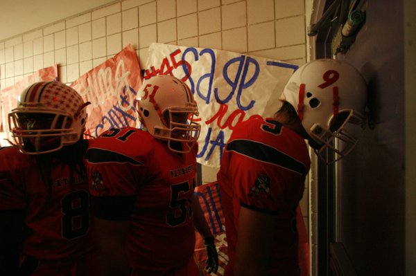 Liberty's Robert Gilliland (9), right, rest his head on the ...