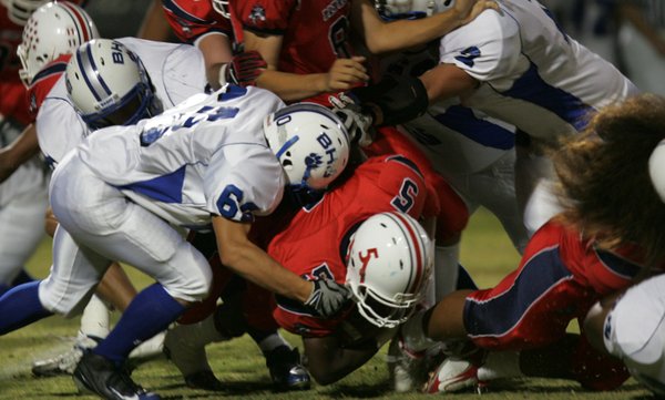 Liberty's Ty Byrd (5) is tackled during Friday's game against ...