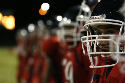 Liberty players look on from the sidelines during Friday's homecoming football game against Basic.