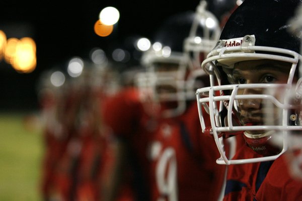 Liberty players look on from the sidelines during Friday's homecoming ...