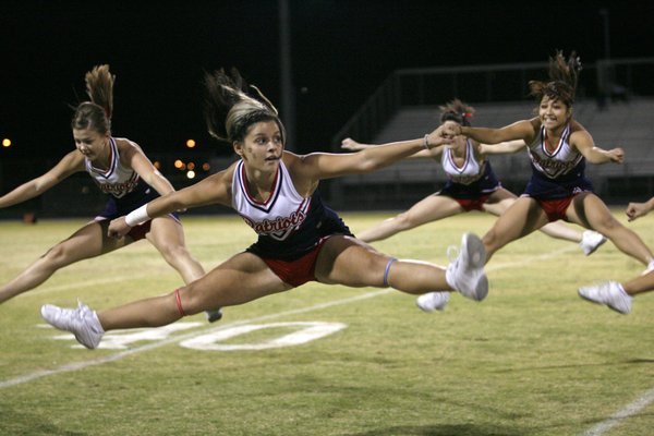 Liberty cheerleaders perform for fans during Friday's school's homecoming football ...