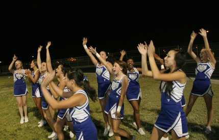 Basic cheerleaders react after their team scores a touchdown Friday against Liberty.