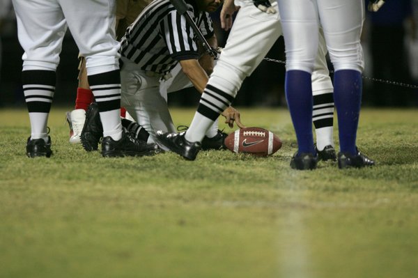 Officials measure a play during Friday's football game at Liberty ...