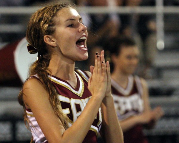 Faith Lutheran cheerleader Stephanie Dewyn, a junior, cheers on with ...