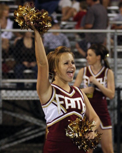 Faith Lutheran cheerleader Jenna Hooks, a junior, cheers on the team during Friday's home football game against Virgin Valley.