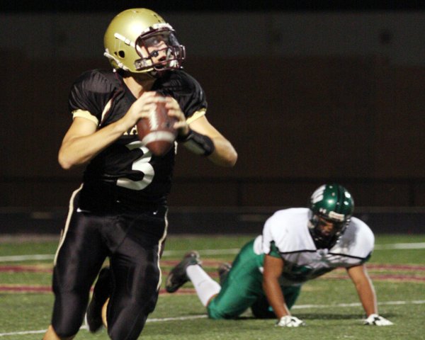 Faith Lutheran quarterback Joe Portaro runs past Virgin Valley during ...