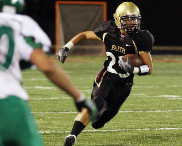 Faith Lutheran running back Henry Liu runs the ball during ...