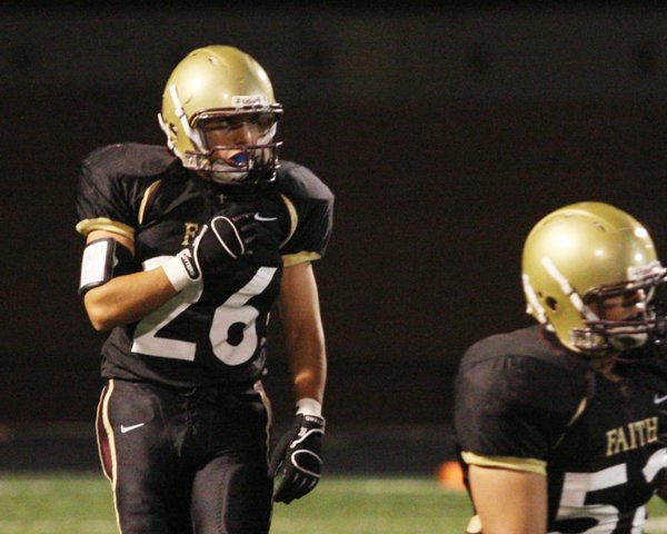 Faith Lutheran linebacker Christian Lopez prepares the line formation before ...