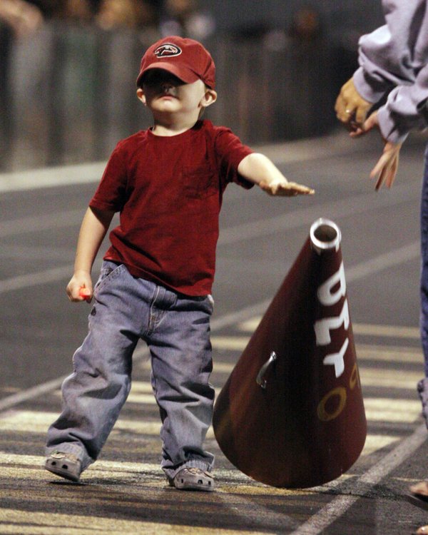 Future Crusader Jackson Arnold, 2, reaches for a megaphone to ...