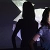 Artist Catherine Borg is lit by a projection of her digital video installation "Self-tending," which is part of her exhibit at The Arts Factory in downtown Las Vegas. She uses video, sculpture and drawing as well as photography, but considers all her work in those media photographic. 