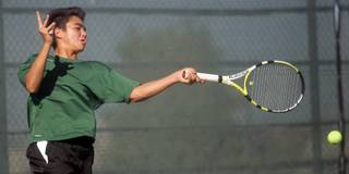 Green Valley's Evan Song returns the ball to Coronado's Mitchell Smith during Sunrise Regional Championship boys' tennis tournament at Coronado High School Tuesday.