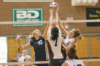 Boulder City's Lexi Jorgensen (10) covers the net during a home game against Pahrump on Oct. 1.