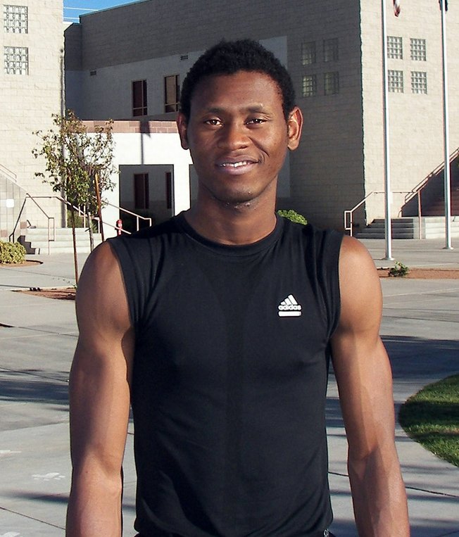 Godwin Okonji, a junior forward for Findlay College Prep, stands outside the school's gym after Tuesdays practice. Okonji landed at the Henderson program after meeting Findlay coaches Mike Peck and Todd Simon at a basketball camp in Lagos, Nigeria, in May 2007. "It was like Gods intervention," he said.