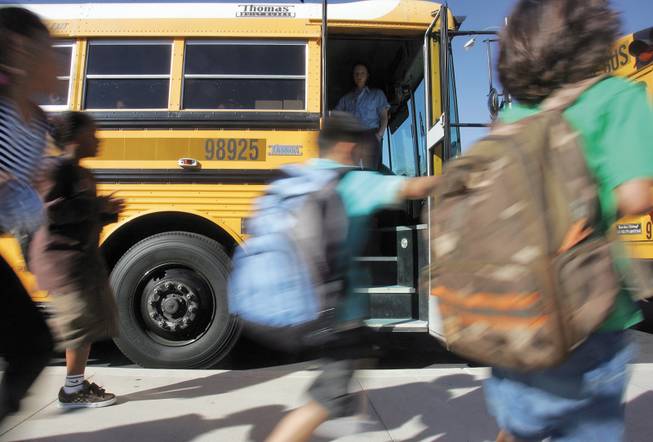 Kathy L. Batterman Elementary School students scamper to their buses to make their way home after a long day of school.