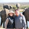 Susie Lee and her husband, Dan Lee, pose during their trip to South Africa this summer. The Lees purchased the trip in a live auction at the Andre Agassi Charitable Foundation's Grand Slam for Children fundraiser last year.