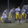 Rhys Harris (76) grapples for the ball at Friday night's game against Del Sol.