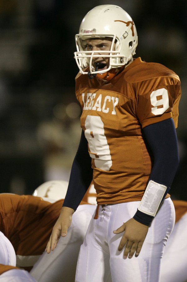 Legacy quarterback Zach Monticelli calls a play from the line ...