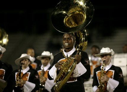 The Longhorn marching band and drill team perform at halftime Friday night.