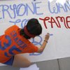 Bishop Gorman junior Alyssa Cramer works on a banner Oct. 5 for the school's homecoming week.