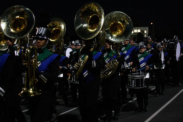 The Green Valley marching band enters the stadium in preparation ...
