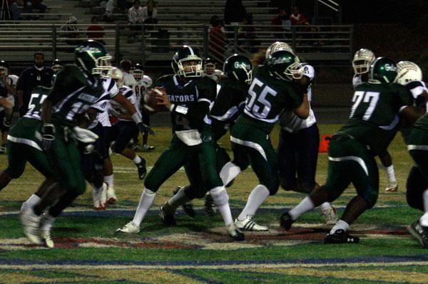 Green Valley quarterback Nick Libonati looks for an opening during ...