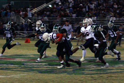 Liberty's Shawn Murray (11) gets tackled by Green Valley's Dallas Halasz during Friday's game at Green Valley.