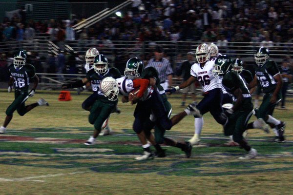 Liberty's Shawn Murray (11) gets tackled by Green Valley's Dallas ...
