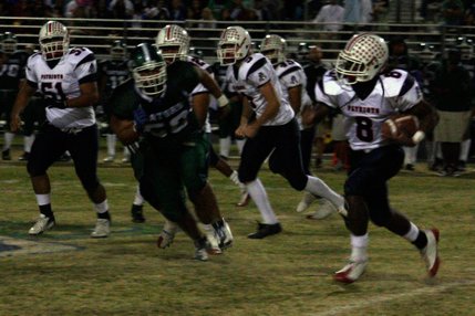 Liberty's Ian Jackson tries to avoid Green Valley's defense during Friday's game.