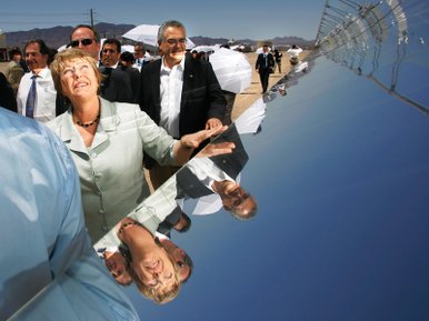 
President Michelle Bachelet of Chile takes a tour of Acciona's 64-megawatt, 400-acre Nevada Solar One array in Boulder City in June.
