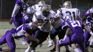 Foothill's Algernon Sewell runs the ball up field against Silverado's defense during Friday's game. Foothill's Algernon Sewell runs the ball up field against Silverado's defense during Friday's game.