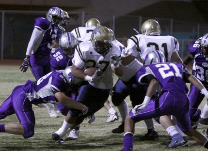 Foothill's Algernon Sewell runs the ball up field against Silverado's defense during Friday's game. 
