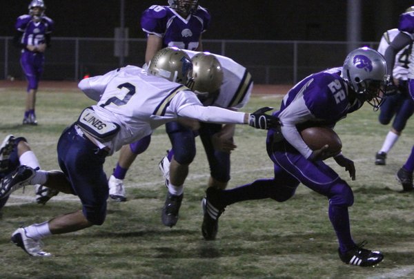 Dariouse Gravely breaks two tackles during Friday night's game against ...