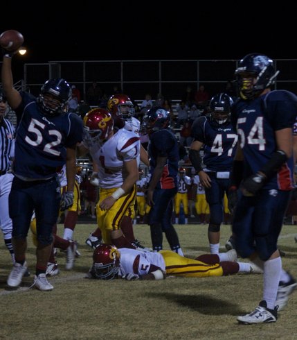 Coronado players celebrate after Earnest Hall fumbles the ball during Friday night's game against Del Sol.
