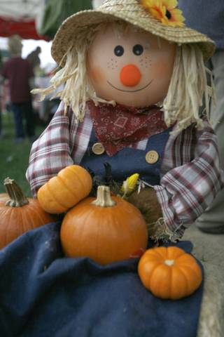 A scarecrow is one of many fall items on display during the Summerlin Pumpkin Festival at the Gardens Park on Saturday.
