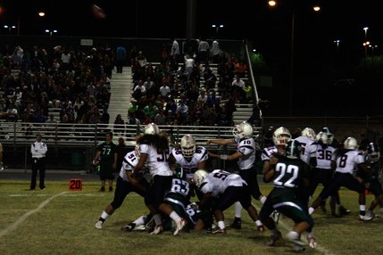 Liberty quarterback Ryan Doty manages to throw the ball over a pile of other players during Friday's game at Green Valley.