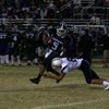 Liberty's Ian Jackson (8) tackles Green Valley's Dallas Halasz (5) during Friday night's game.