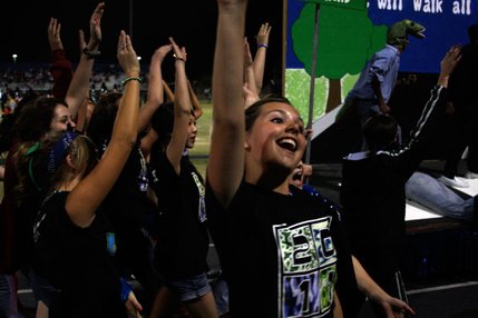 The Green Valley class of 2011 chants while walking alongside its homecoming float during halftime of Friday's game against Liberty.