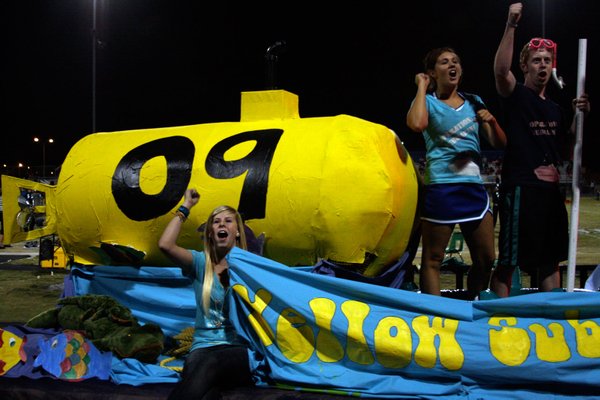 Green Valley seniors cheer on the crowd while riding their ...