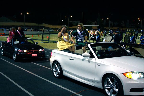 The Green Valley homecoming court rides past the crowd during ...